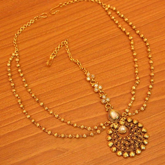Gold pearl maang-tikka