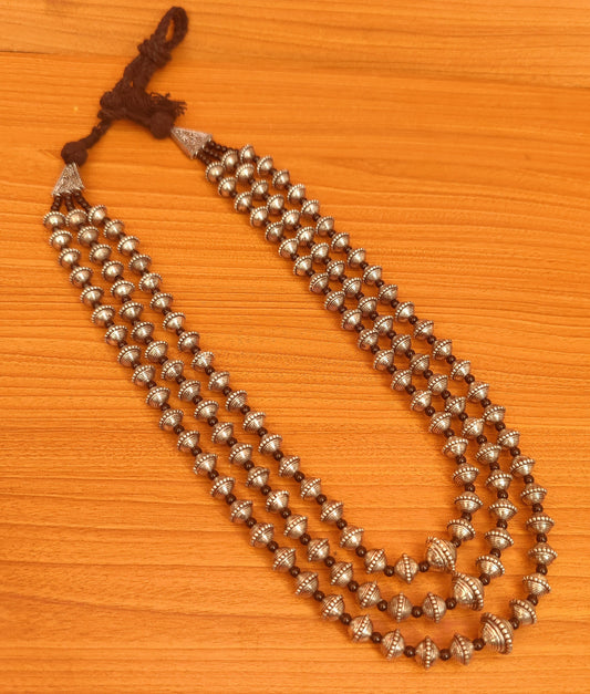 MULTILAYERED SILVER LOOK ETHNIC NECKLACE