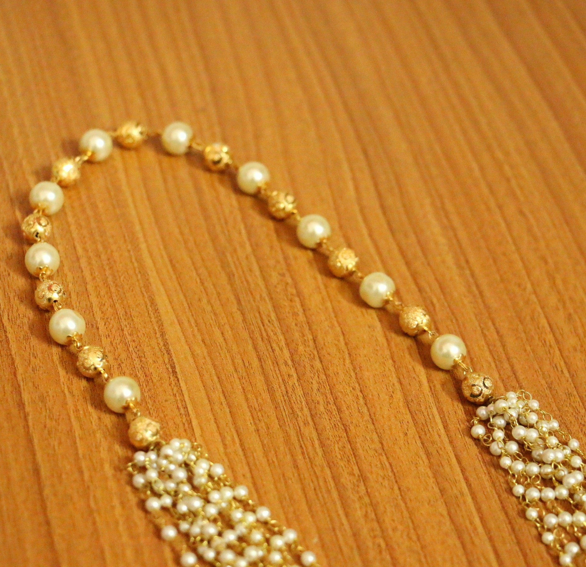 Buy Multiline Rice Pearl Necklace in Gold | Krishna Jewellers
